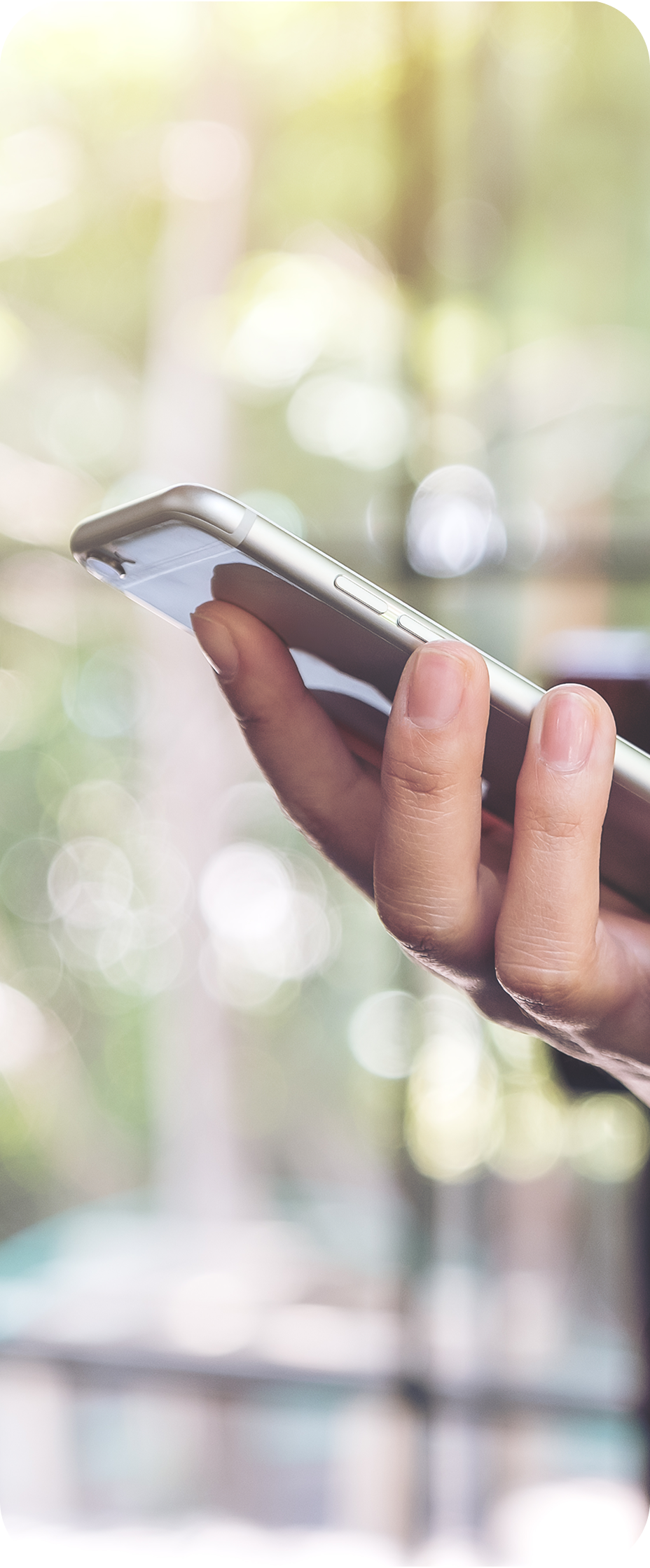 Close-up of a team member holding a smartphone